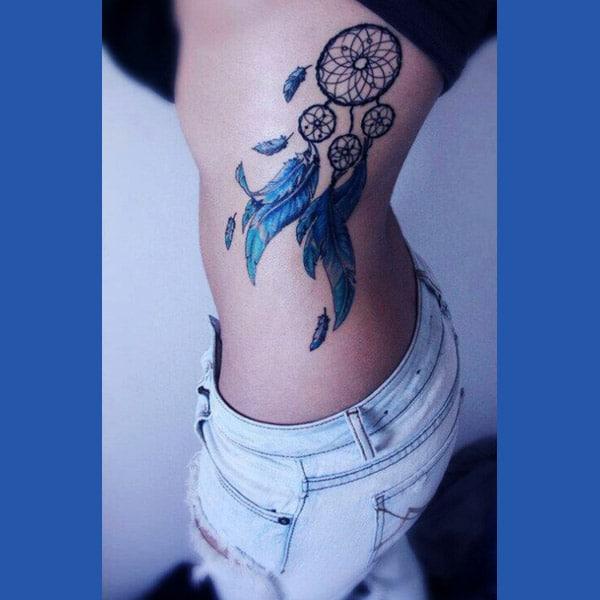 feather tattoo on side