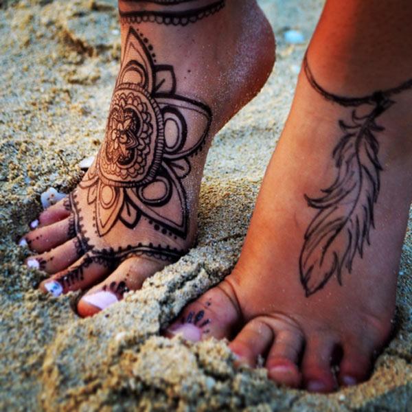 feather tattoo on foot