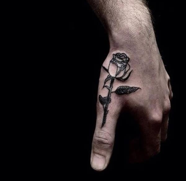 rose on finger tattoo