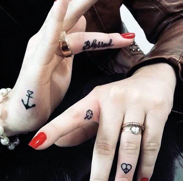 girl finger tattoos