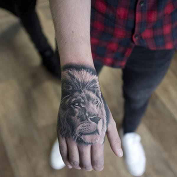 lion hand tattoo