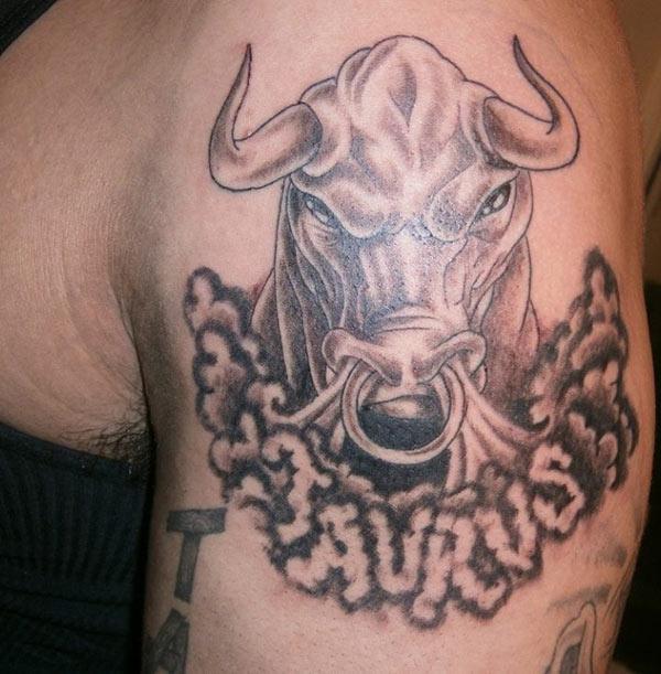 He shows his Taurus tattoo on upper arm to symbolize strength