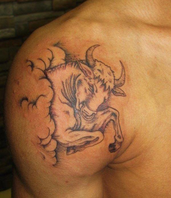 make a designer Taurus tattoo on shoulder region of men