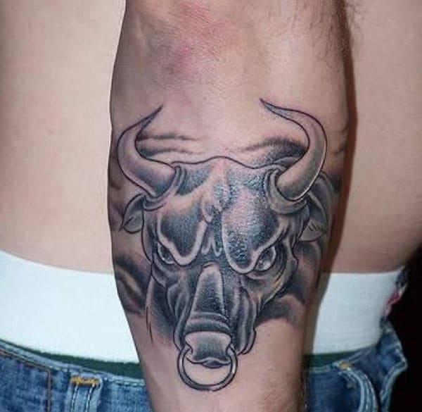 black mixes naturally with the bold look of Taurus tattoo