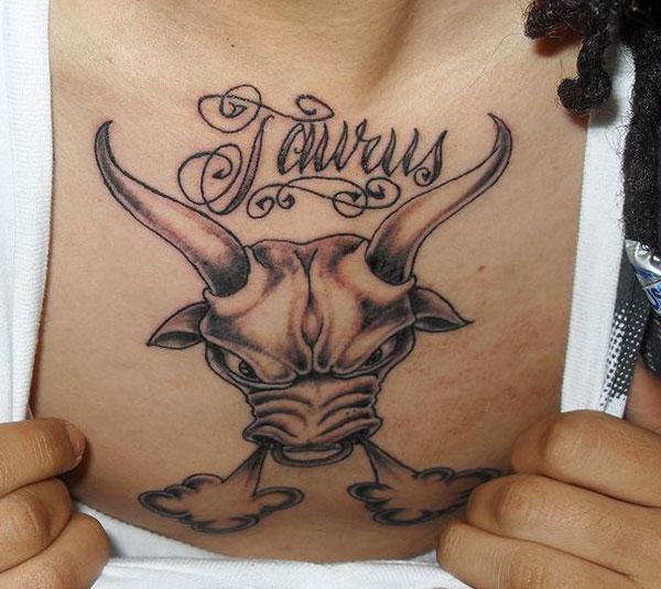 calligraphy Taurus tattoo on chest region of boy