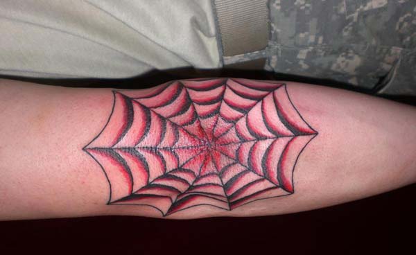 spider web tattoo on elbow