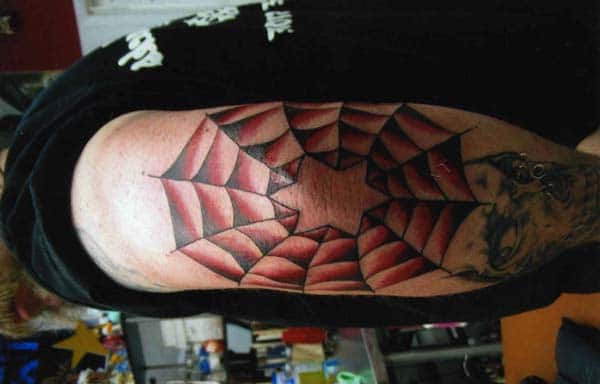 spider web on elbow tattoo