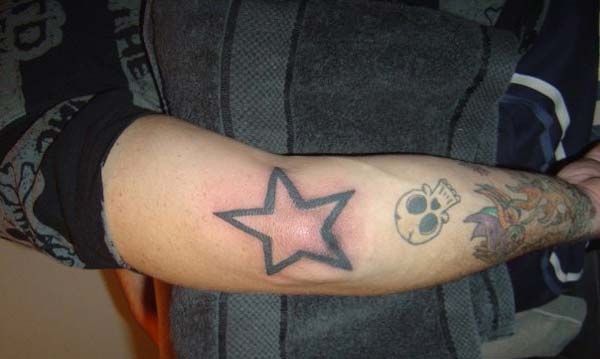 Star elbow tattoo design idea for men