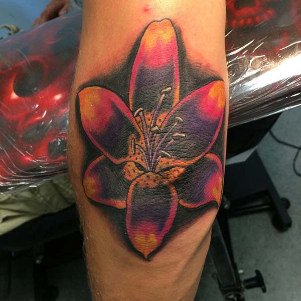 colorful flower elbow tattoo design idea for boys