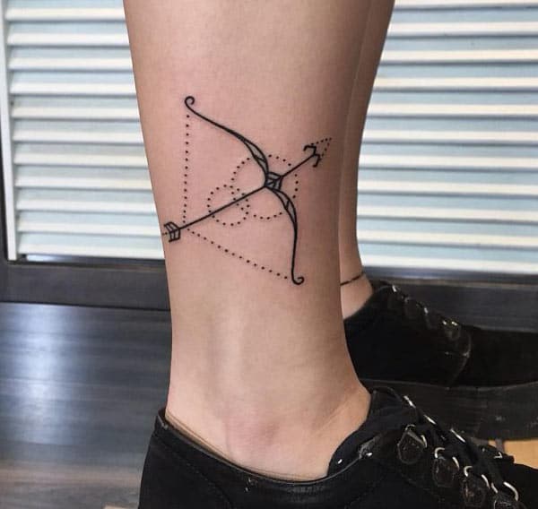 Simple black Sagittarius tattoos on the right leg for courage