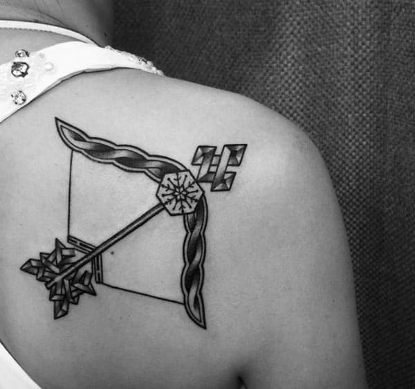 make a simple attractive Sagittarius tattoo on back to flaunt yourself