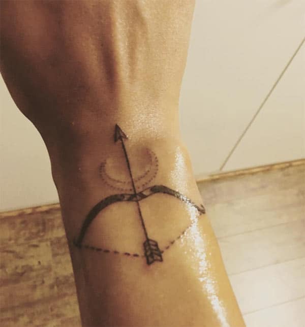 Stylish wrist Sagittarius tattoo on her hand for lovely look