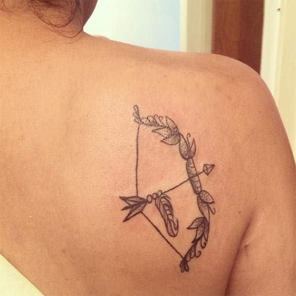 simple black arrow Sagittarius tattoo on your back for women