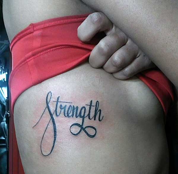 women strength tattoos