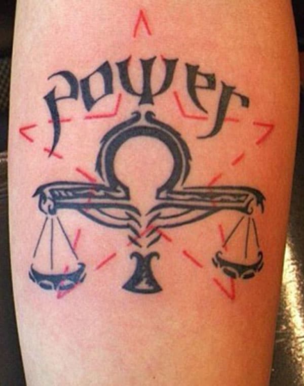 This tattoo design is made up for the inside elbow with balance symbol