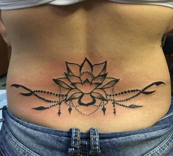 A delightful lower back tattoo for girls