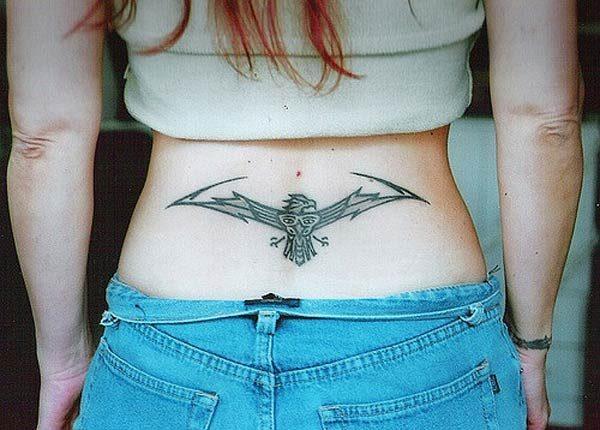 A catchy lower back tattoo design for Girls to try