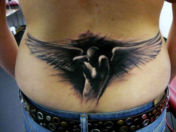 An awe-inspiring lower back tattoo for women