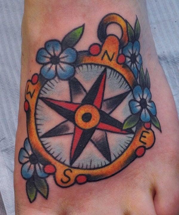 compass tattoo on foot