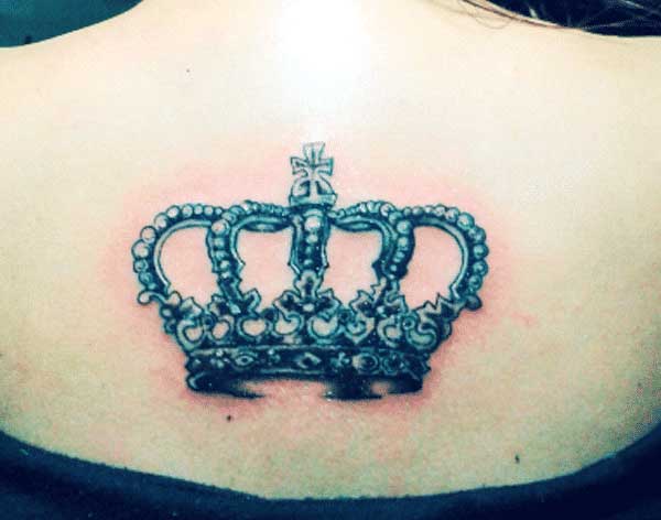 girl crown tattoo on back