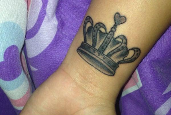 crown tattoo on wrist