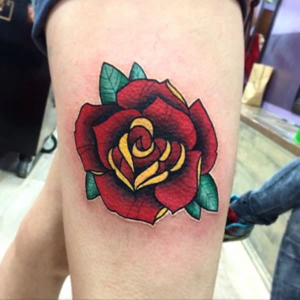 rose tattoo on thigh