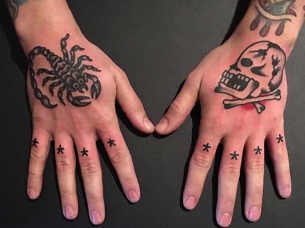skull and scorpion hand tattoos