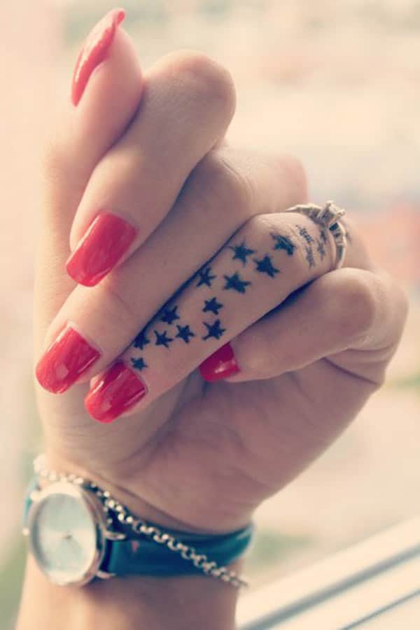 star tattoo on finger