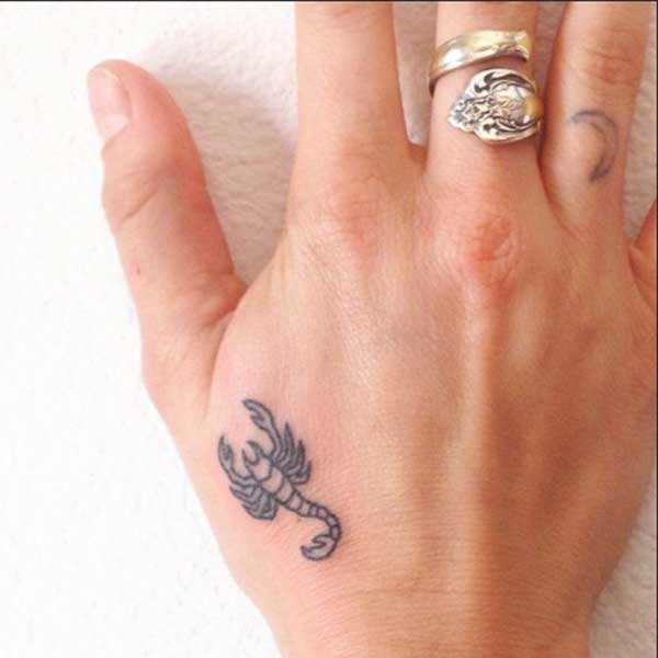 hand scorpion tattoos
