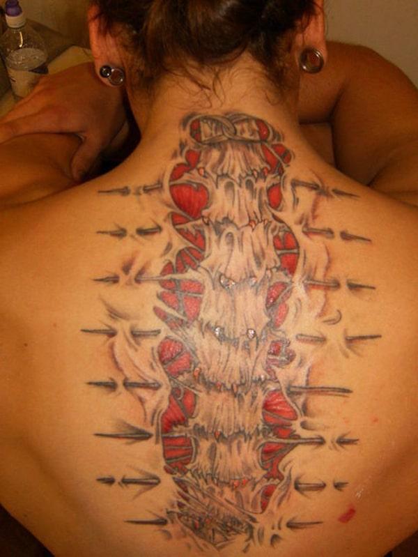 Spine tattoo on the back makes a woman look attractive and cute