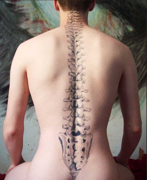Spine tattoo on the back brings the captivating look