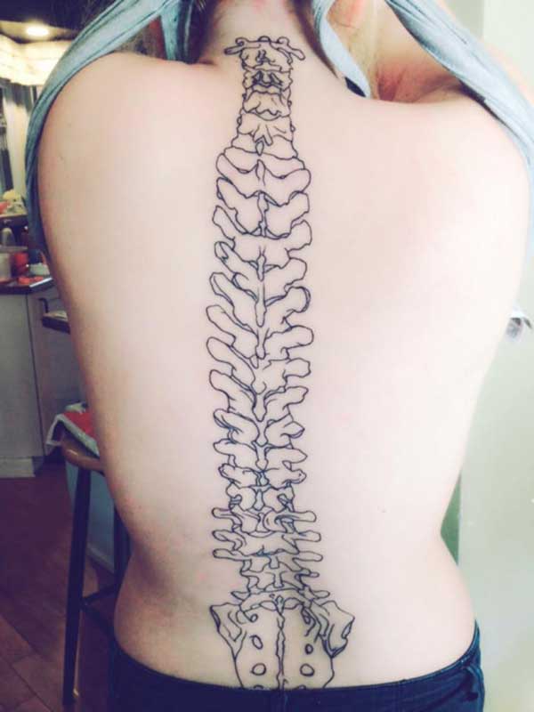 Spine tattoo on the back brings an astonishing look
