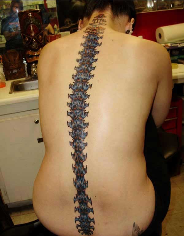 Spine tattoo on the back brings the elegant look