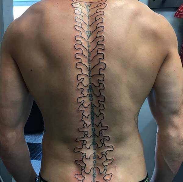 Spine tattoo on the back brings the foxy look in men