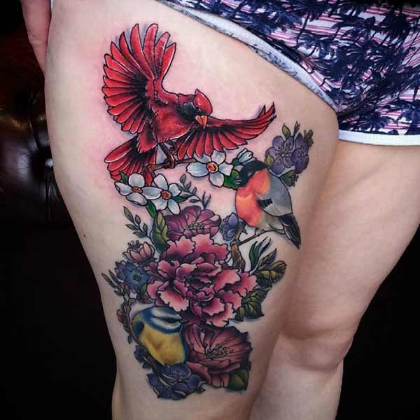 birds and flower thigh tattoo idea for women’s