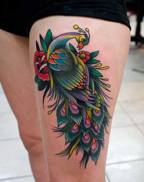 amazing peacock thigh tattoo design idea for girls