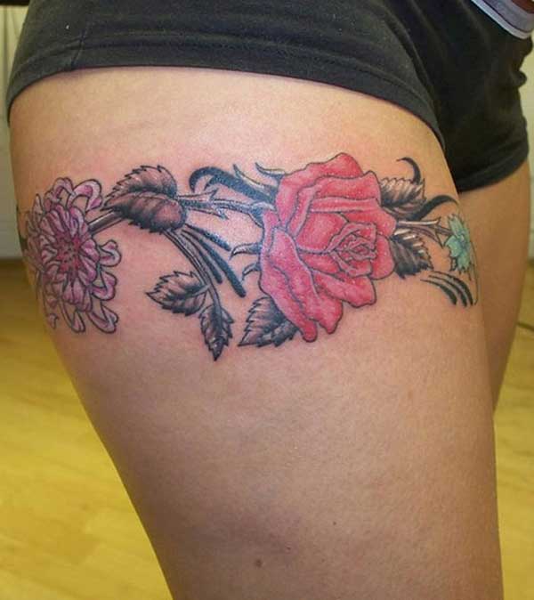 rose tattoo design on upper thigh