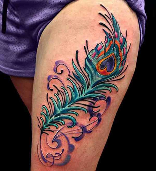 peacock feather thigh tattoo ink idea for women