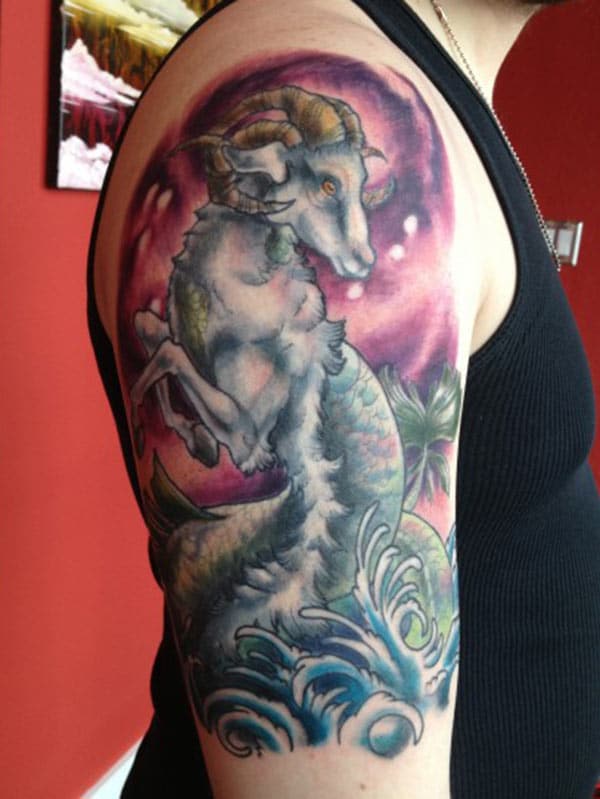 Capricorn tattoo on the right upper arm brings the moralistic look in men