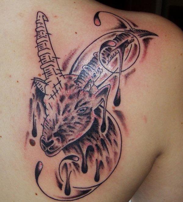This Capricorn tattoo at the back have colorful ink design to make it look attractive 