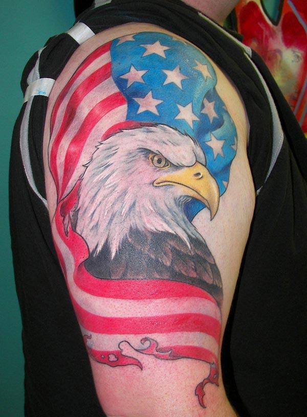 The American Flag Tattoo on the upper right arm with eagle make a man look admirable