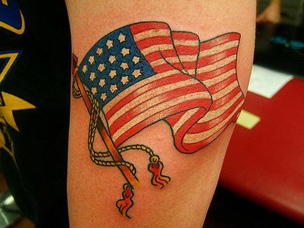 The design ink on this American Flag Tattoo on the elbow makes men have an eye-catching look