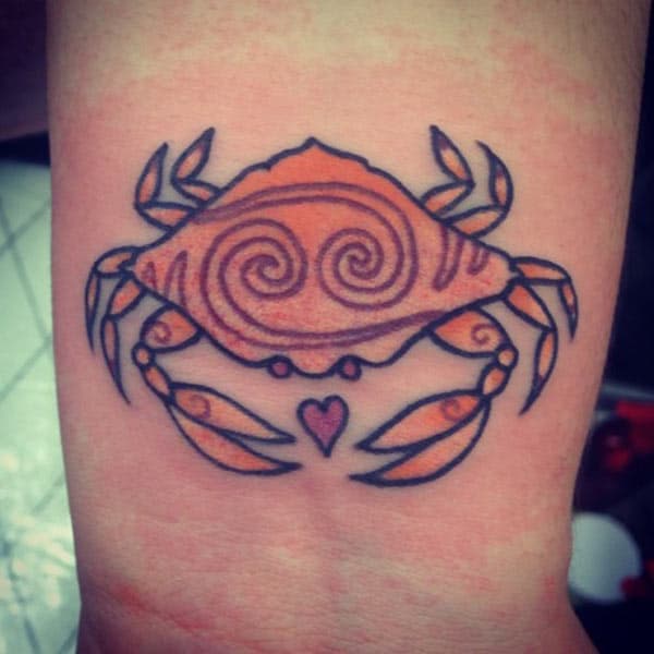 The ink design idea on the Cancer Zodiac on the wrist brings the loyalty in girls