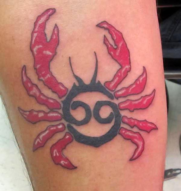 The pink Cancer Zodiac Tattoo on the upper inner arm makes a man look glamorous