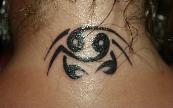 Cancer Zodiac Tattoo on the back neck of a girl make her look enchanting 