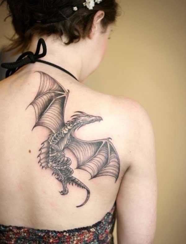 the girl with the flying dragon tattoo design on her back