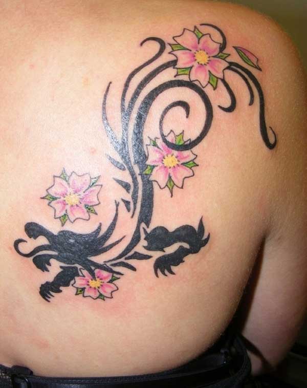 girl with the dragon and flower tattoo design on her back