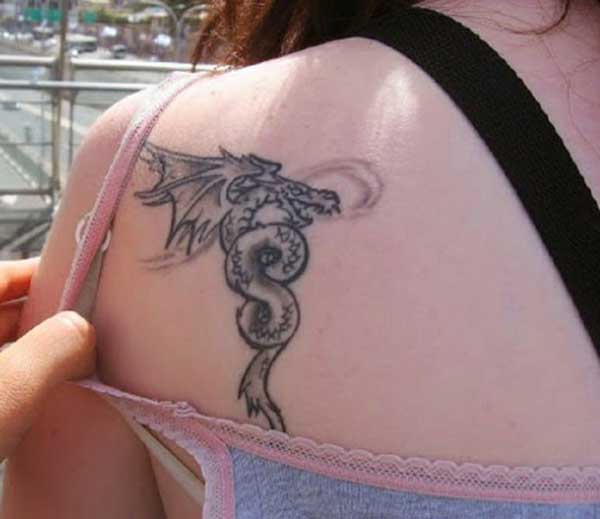 sweet girl with the cute small dragon tattoo on her back