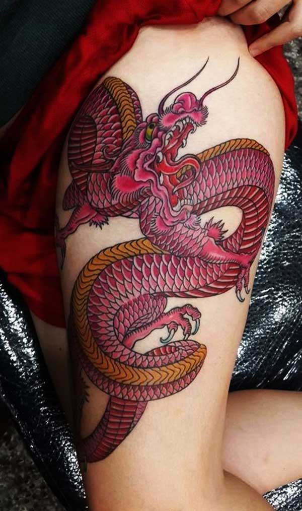 The girl with the red ink dragon tattoo design on her leg