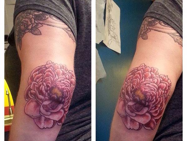 red flower tattoo design idea for girls on the elbow